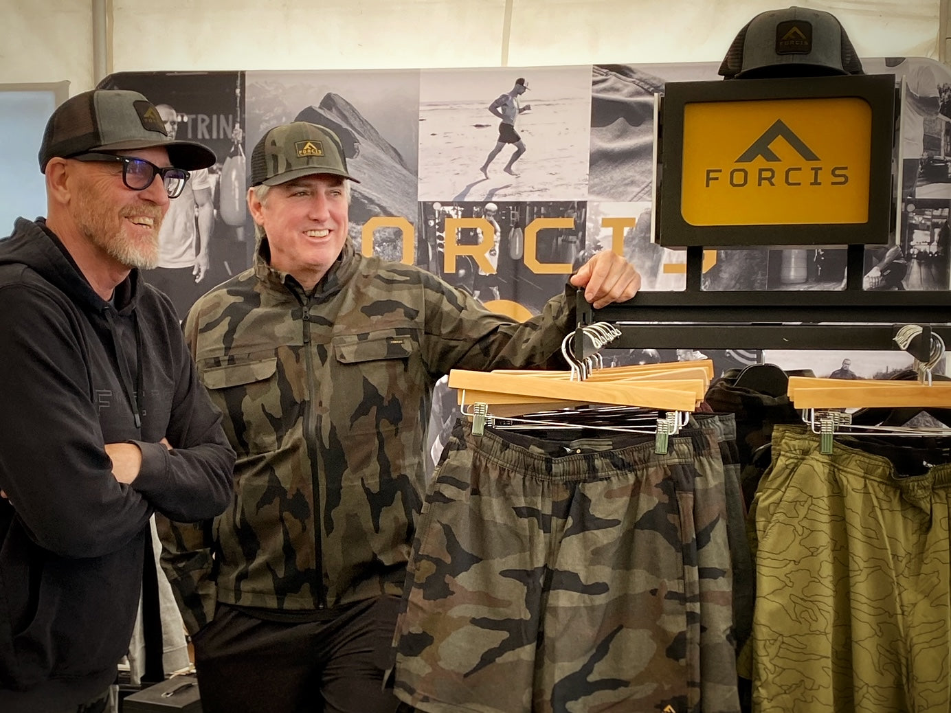 John and Mike standing at the Forcis booth in Surf City for the 2024 Marathon Expo.